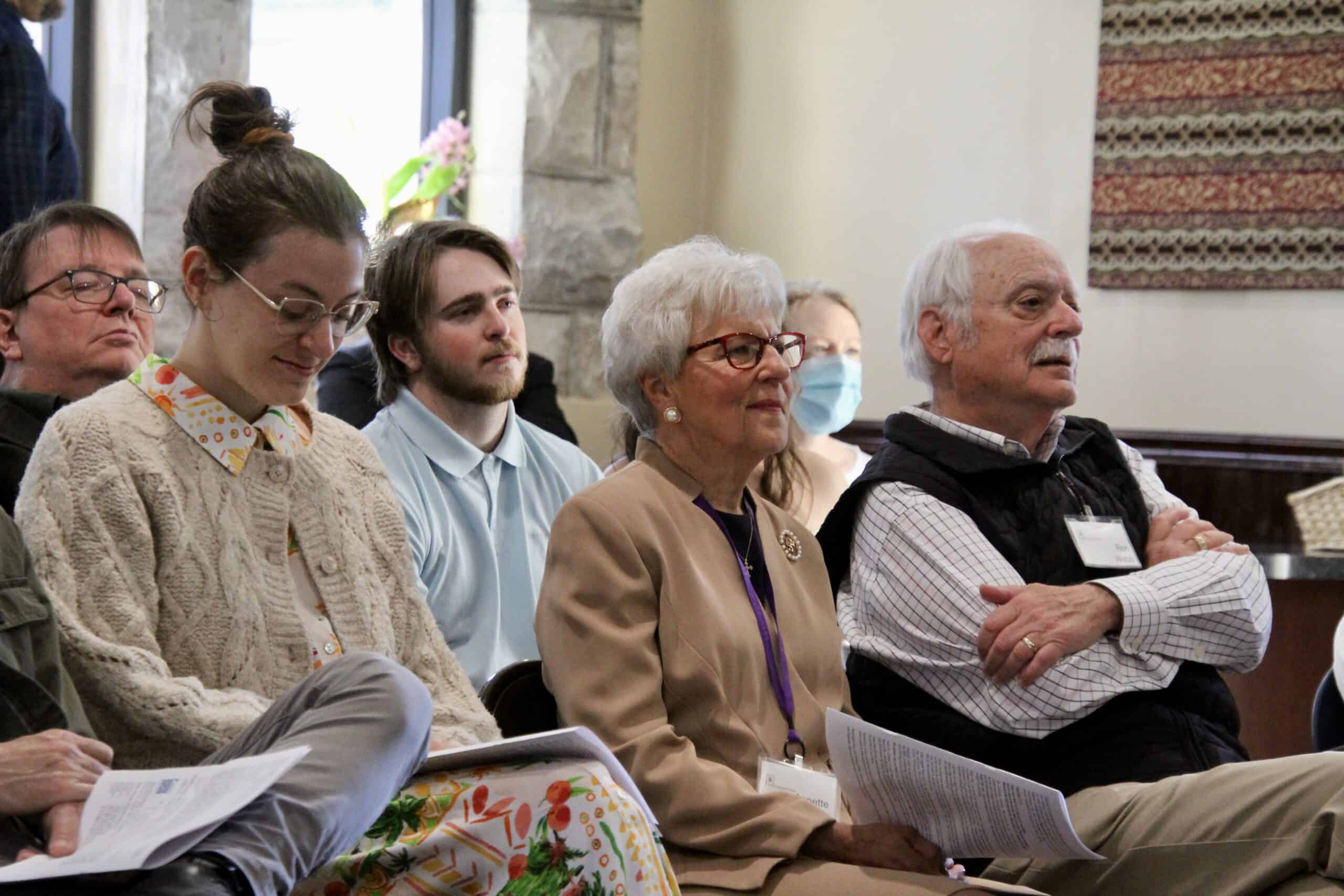 Choir members in white robes performing during church service at Downtown Presbyterian Church.