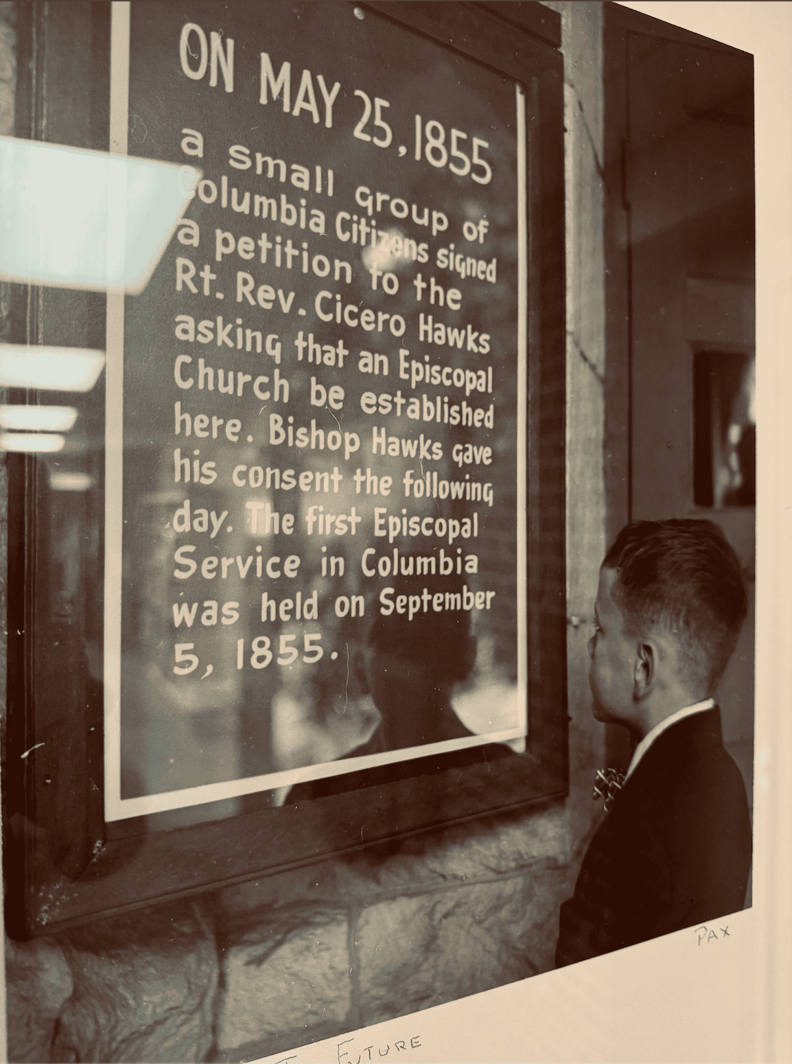 Historic Calvary Episcopal Church commemorative plaque with a young boy reading the inscription.