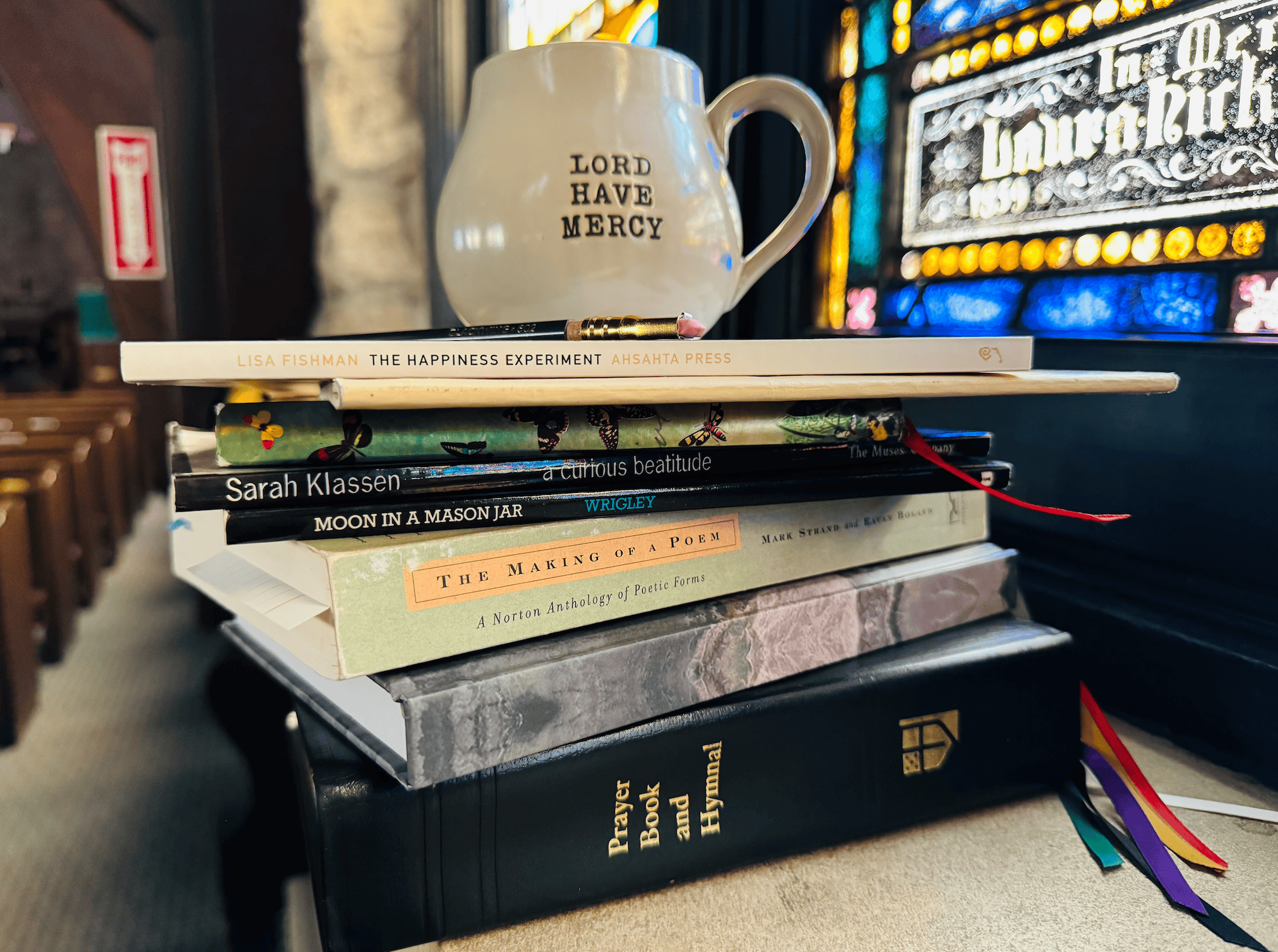 Books and a mug with "Lord Have Mercy" at Calvary Episcopal Church.